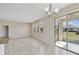 Open dining area with sliding glass doors to outdoor patio at 1028 Sadie Ridge Rd, Clermont, FL 34715