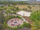 Aerial view of a cozy outdoor fire pit surrounded by comfortable seating, ideal for gatherings and relaxation at 1028 Sadie Ridge Rd, Clermont, FL 34715