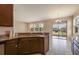 Well-equipped kitchen featuring stainless steel countertops and dark wood cabinets at 1028 Sadie Ridge Rd, Clermont, FL 34715