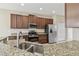 Kitchen with stainless steel appliances, granite countertops, and a double sink at 1028 Sadie Ridge Rd, Clermont, FL 34715
