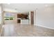 Open concept living space with kitchen, dining area, and ample natural light at 1028 Sadie Ridge Rd, Clermont, FL 34715