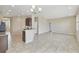 Open-concept living area featuring tile floors, kitchen counter, and easy access to other rooms at 1028 Sadie Ridge Rd, Clermont, FL 34715