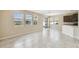 Spacious living area with tile flooring, multiple windows, and sliding door access at 1028 Sadie Ridge Rd, Clermont, FL 34715