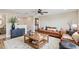 Relaxing living room with natural light, hardwood floors, and comfortable furniture, perfect for Gathering gatherings at 1028 Sadie Ridge Rd, Clermont, FL 34715