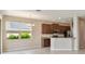 Open-concept living space with kitchen, ample light, and dining area at 1028 Sadie Ridge Rd, Clermont, FL 34715
