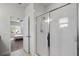 This bathroom features a glass shower door and view into bedroom with bed and window at 1052 Avila Ln, Orlando, FL 32803