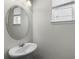 Bathroom with white vanity and window at 1052 Avila Ln, Orlando, FL 32803