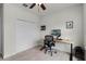 Neutral bedroom featuring a ceiling fan, a closet, and a desk for a modern, adaptable space at 1052 Avila Ln, Orlando, FL 32803