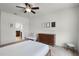 Cozy bedroom features neutral walls, plush carpet, ceiling fan, and furniture at 1052 Avila Ln, Orlando, FL 32803