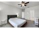 Relaxing bedroom boasts neutral walls, cozy carpet, ceiling fan, and classic decor at 1052 Avila Ln, Orlando, FL 32803