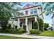 Charming two-story home with landscaped yard, front porch, and inviting curb appeal at 1052 Avila Ln, Orlando, FL 32803