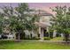 Exterior view of a home with manicured landscaping, sidewalks, and a well-maintained lawn at 1052 Avila Ln, Orlando, FL 32803