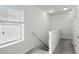 Upstairs hallway with white walls, carpet and window at 1052 Avila Ln, Orlando, FL 32803