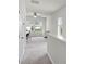 Hallway view of office area featuring neutral walls, carpet, and bright windows at 1052 Avila Ln, Orlando, FL 32803