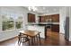 Kitchen with wood cabinets, stainless steel appliances, and a breakfast bar at 1052 Avila Ln, Orlando, FL 32803