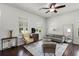 Bright living room with natural light, hardwood floors, neutral furniture, and stylish decor at 1052 Avila Ln, Orlando, FL 32803