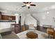 Open-concept living room with hardwood floors, modern furniture, and seamless kitchen access at 1052 Avila Ln, Orlando, FL 32803