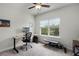 This office features neutral walls, carpet, ceiling fan, and a window with green views at 1052 Avila Ln, Orlando, FL 32803