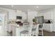 Modern kitchen with white cabinets, stainless steel appliances, and a large island with seating at 1078 Clay Blvd, Tavares, FL 32778