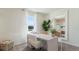 Bright office space with a modern desk, comfortable chairs, and a large mirror, creating a stylish and functional workspace at 1078 Clay Blvd, Tavares, FL 32778