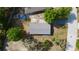Aerial view of the property showcasing the roof and surrounding trees at 111 Palencia Rd, Auburndale, FL 33823