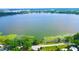 Scenic aerial view of the lake with lush greenery along the shoreline at 111 Palencia Rd, Auburndale, FL 33823