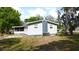 Backyard view of a home with aluminum siding at 111 Palencia Rd, Auburndale, FL 33823