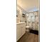 Bathroom featuring a vanity, toilet, shower, and charming Paris-themed shower curtain at 111 Palencia Rd, Auburndale, FL 33823
