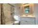 Modern bathroom features a marble tiled shower, sleek vanity, and updated fixtures at 111 Palencia Rd, Auburndale, FL 33823