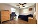 Cozy bedroom offers a peaceful retreat with natural light, closet, and fan at 111 Palencia Rd, Auburndale, FL 33823