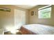 Comfortable bedroom with a bright window, closet, and cozy decor at 111 Palencia Rd, Auburndale, FL 33823