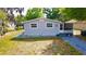 Charming single story home featuring a well-maintained front yard and a white picket fence at 111 Palencia Rd, Auburndale, FL 33823