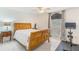 Bright bedroom featuring hardwood furniture, decor and a window overlooking the property at 11400 Lovers Ln, Winter Garden, FL 34787