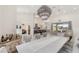 Open-concept dining area with decorative lighting flowing into living and kitchen areas at 11400 Lovers Ln, Winter Garden, FL 34787