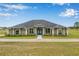 Charming one-story home featuring lush landscaping and a welcoming entrance at 11400 Lovers Ln, Winter Garden, FL 34787