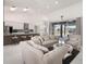 Spacious living area open to the kitchen, featuring high ceilings and modern finishes at 11400 Lovers Ln, Winter Garden, FL 34787