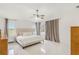 Bright main bedroom featuring neutral tones, large windows, and ensuite bathroom access at 11400 Lovers Ln, Winter Garden, FL 34787