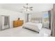 Bright main bedroom featuring neutral tones, large windows, and tile flooring at 11400 Lovers Ln, Winter Garden, FL 34787