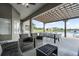 Inviting covered patio with wicker furniture and an outdoor dining area overlooking the pool at 11400 Lovers Ln, Winter Garden, FL 34787