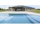 Stunning pool area, with solar panels and the back of the home in the background at 11400 Lovers Ln, Winter Garden, FL 34787