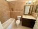 Cozy bathroom features tiled walls, bathtub, vanity and updated fixtures at 12101 Kendra Ct, Orlando, FL 32824