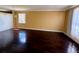 Spacious living room featuring shiny hardwood floors and a bright window at 12101 Kendra Ct, Orlando, FL 32824