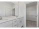 Modern bathroom with double vanity, quartz countertops, and closet at 1263 Stockwell Ave, St Cloud, FL 34771