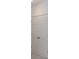 White bi-fold closet doors with silver hardware at 1263 Stockwell Ave, St Cloud, FL 34771