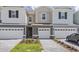 Charming townhomes featuring brick driveways, manicured lawns, and attached one-car garages at 1263 Stockwell Ave, St Cloud, FL 34771