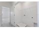 A laundry room featuring an open doorway and a wire shelf at 1263 Stockwell Ave, St Cloud, FL 34771