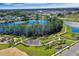 Aerial view of community park with pond, playground, and dog park for outdoor enjoyment at 13540 Autumn Harvest Ave, Winter Garden, FL 34787