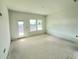 Spacious bedroom offering great natural light with access to a balcony at 13540 Autumn Harvest Ave, Winter Garden, FL 34787