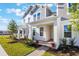 Inviting townhome exterior with brick walkway, well-maintained landscaping, and covered porch at 13540 Autumn Harvest Ave, Winter Garden, FL 34787