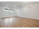Inviting living space boasting wood floors, recessed lighting, and stylish chandelier at 13540 Autumn Harvest Ave, Winter Garden, FL 34787